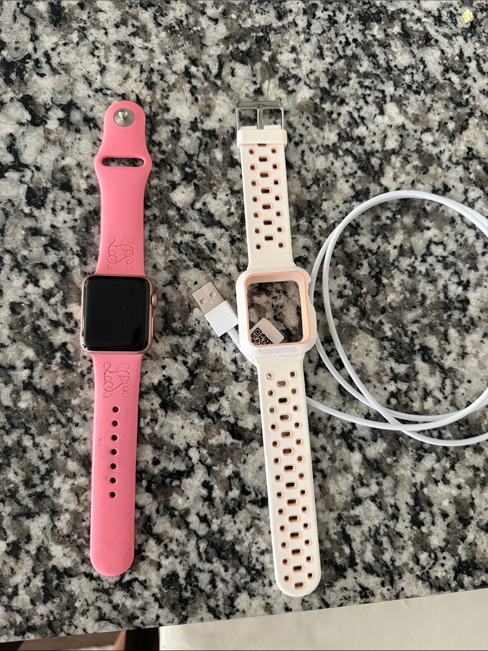 Apple Watch Series 3 with Pink Silicone Band and White Perforated Band